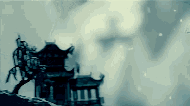 a silhouette of a building with a lantern on it