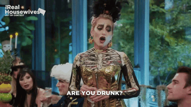 a woman in a skeleton costume says " are you drunk " at a party