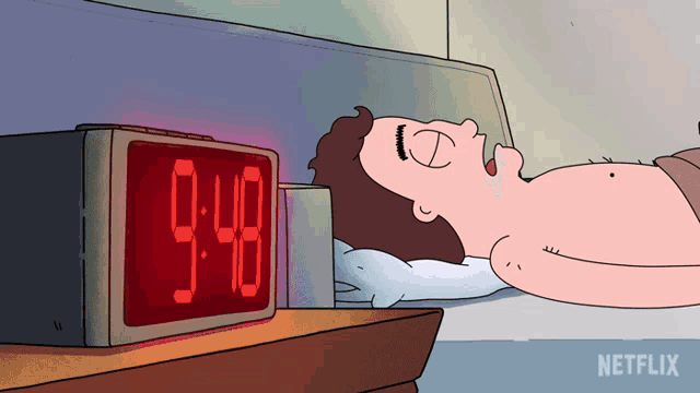 a cartoon of a man laying in bed next to an alarm clock that says 9:58