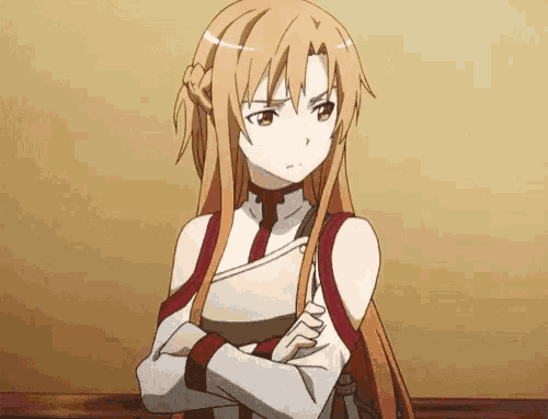 a girl with long hair is standing with her arms crossed and making a funny face .