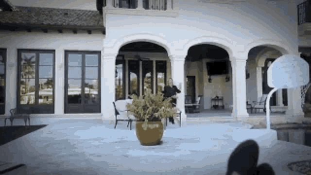 a basketball hoop sits in front of a house