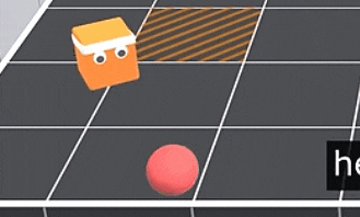 a pile of orange and white cubes on a black tile floor