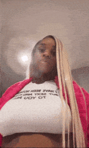 a woman with long blonde hair is wearing a white shirt that says " i have been a uoy of "