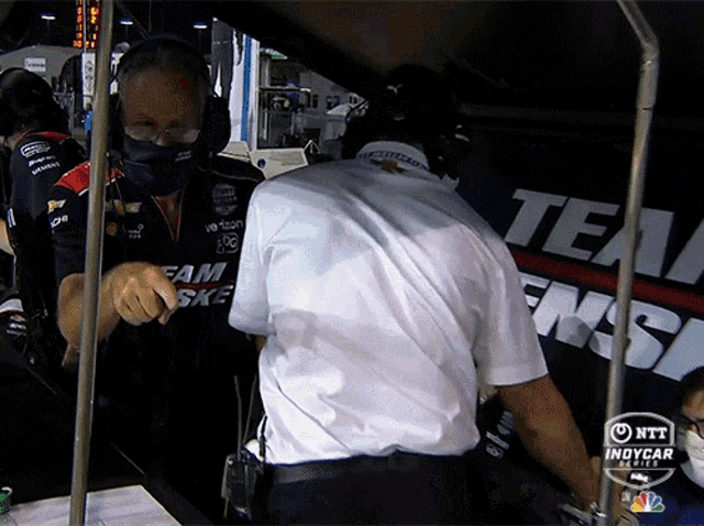 a man wearing a shirt that says team skf