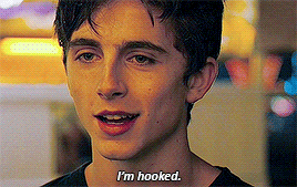 a young man says i 'm hooked in a close up of his face .