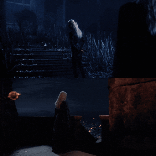 a woman with long blonde hair is standing in the dark