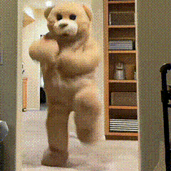 a teddy bear is standing in a hallway in front of shelves