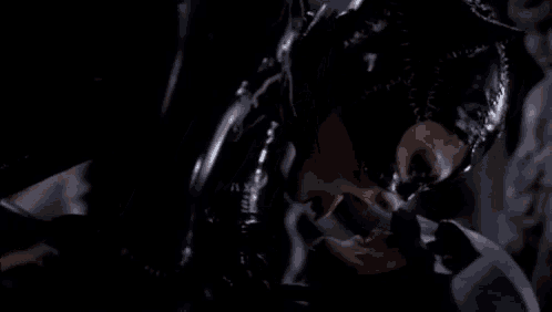 a close up of a woman in a catwoman costume holding a bat .