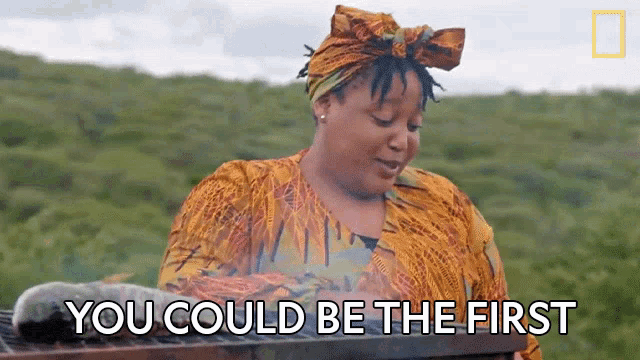 a woman is holding a grill and saying you could be the first .