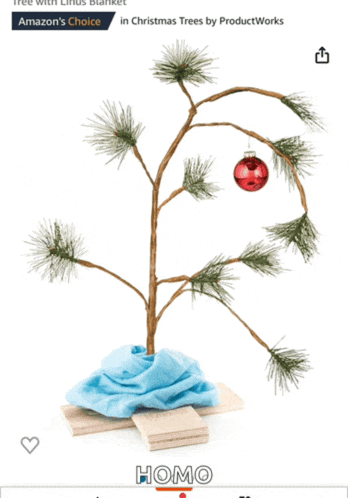 a small christmas tree with a scarf around it