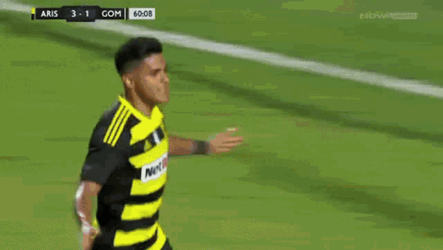 a soccer player celebrates a goal during a game
