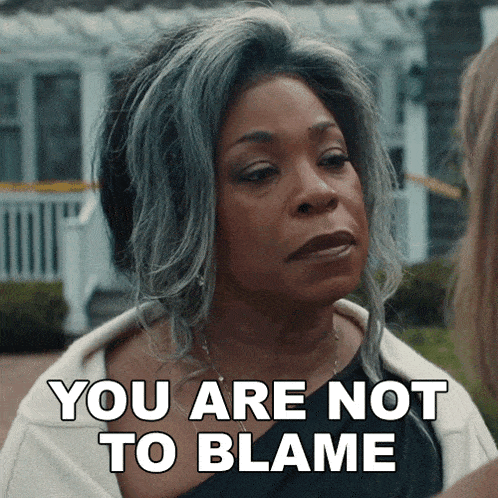 a woman says " you are not to blame " in front of a white house