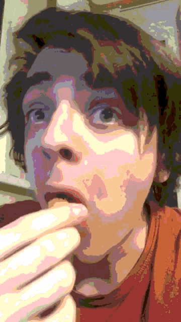 a pixelated image of a person 's face with their mouth open