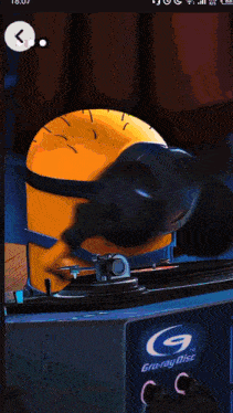 a picture of a minion wearing headphones and a record player that says gruray disc on it