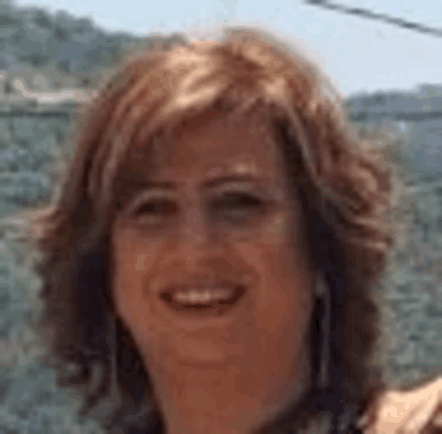 a close up of a woman 's face smiling .