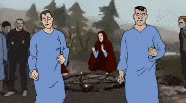 a group of people are standing around a circle with candles in it .