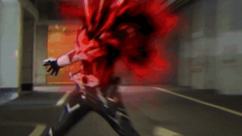 a blurry picture of a person in a red and black outfit