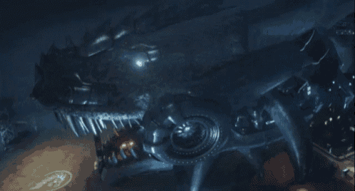 a giant robotic monster with sharp teeth is being attacked by a person in a dark room
