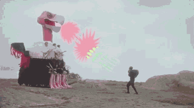 a group of people are standing in front of a large inflatable bird .