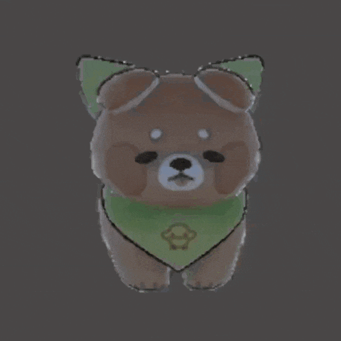 a brown dog wearing a green scarf and a green leaf on its head