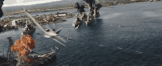 a plane is flying over a large body of water with ships in the background