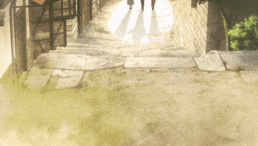 a couple walking down a narrow stone path
