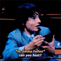 a man in a blue suit is talking to jimmy fallon can you host ?