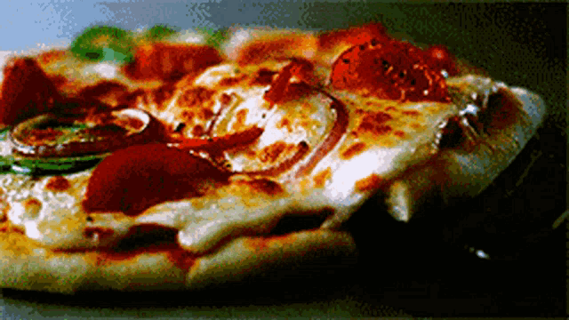 a pizza with a lot of toppings is on a table