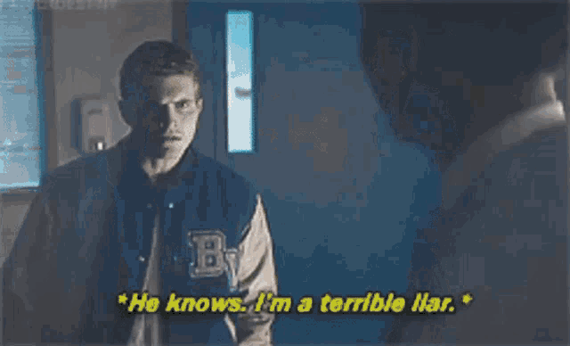 two men are standing next to each other in a living room and talking .