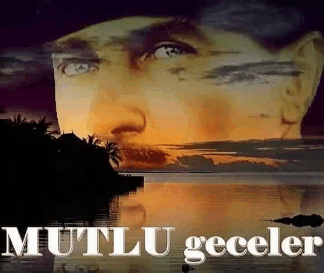 a close up of a man 's face with a sunset in the background