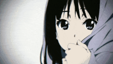 a close up of a girl covering her face with her hands