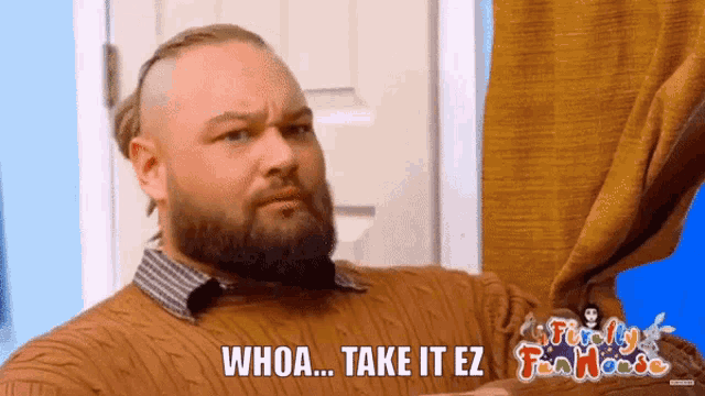 a man with a beard is holding a curtain and saying whoa ... take it ez .