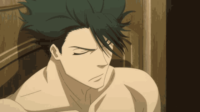 a man without a shirt is looking down with a serious look on his face