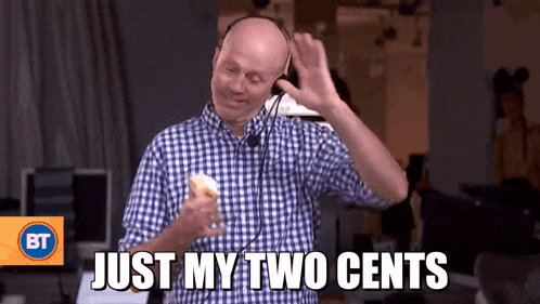 a man wearing headphones says just my two cents while holding a piece of food