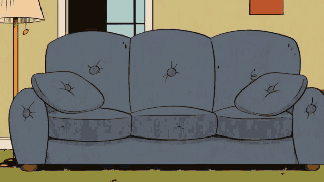 a blue couch with holes in it is in a living room with a lamp