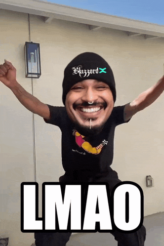a man wearing a beanie and a shirt that says wizard x
