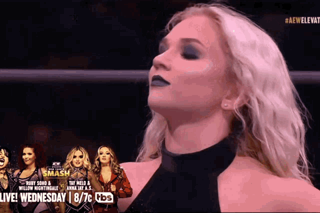 a female wrestler is standing in front of a banner that says smash