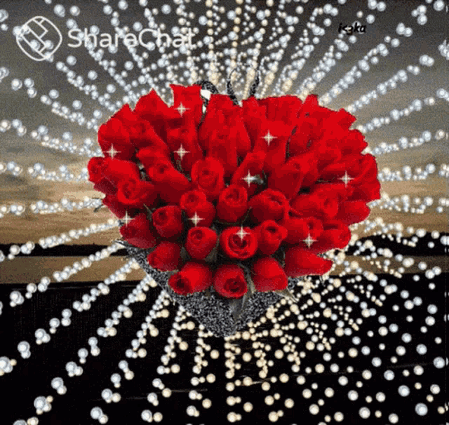 a bunch of red roses in a heart shaped basket