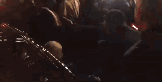 a man holding a gun in a dark room