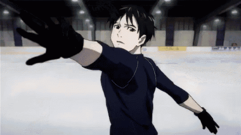 a man in a black shirt and black gloves is skating on a rink .