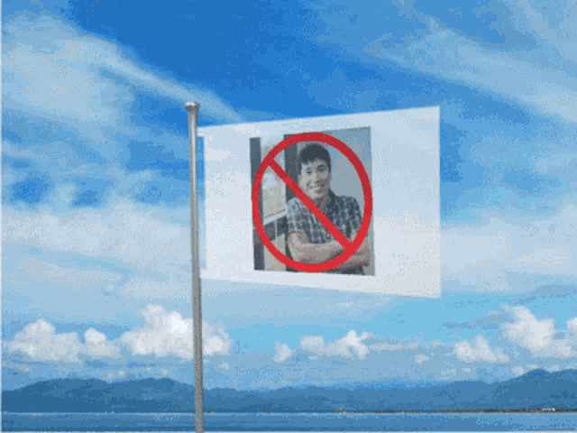 a flag with a picture of a man in a plaid shirt with a red circle around it