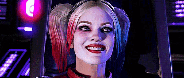a close up of a woman in a harley quinn costume smiling in a dark room .