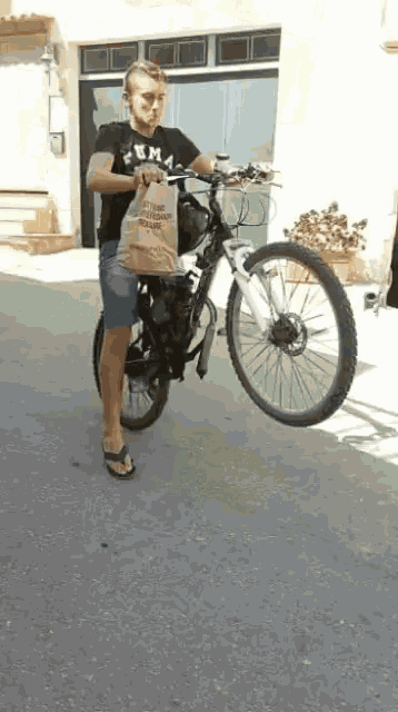 a man is riding a bike with a bag that says ' a few pieces of meat ' on it
