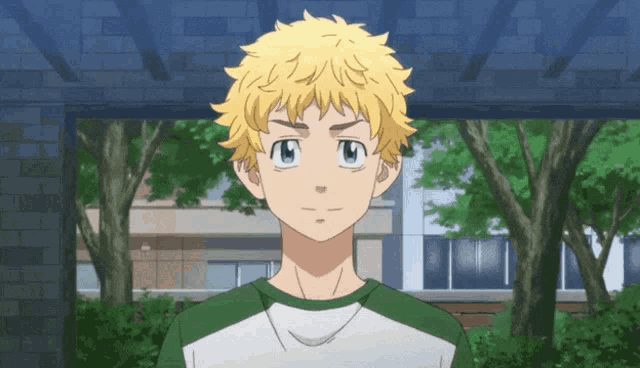 a young boy with blonde hair and blue eyes is standing in front of a building