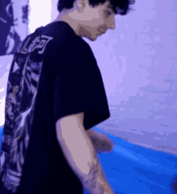 a man wearing a black shirt with chinese characters on it