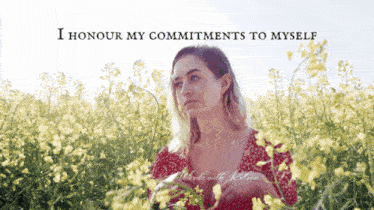 a woman in a field of yellow flowers with the words " i honour my commitments to myself "