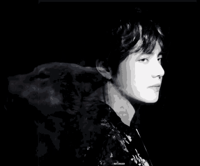 a black and white photo of a man and a wolf with my lycanthrope written in red