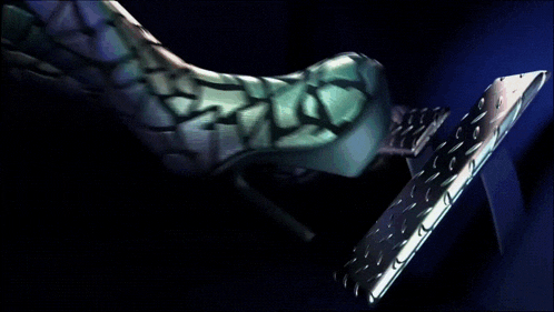 a close up of a person 's foot wearing a shoe with a pattern