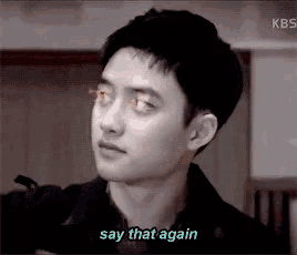 a black and white photo of a man with the words say that again behind him