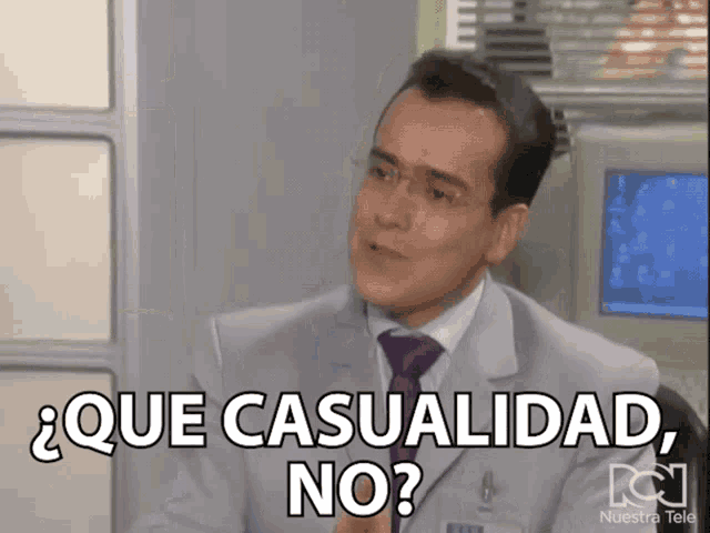 a man in a suit and tie is asking que casualidad no